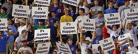 Fans of the Chicago Cubs hold up signs reading " it's gonna happen " between innings against the Atlanta Braves at Wrigley Field. (Jerry Lai-US PRESSWIRE)