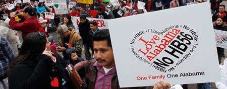Immigration law protestors gather outside the Alabama Statehouse in Montgomery, Ala., Tuesday, Feb. 14, 2012. About 400 demonstrators protested House Bill 56 which is considered one of the strongest immigration laws in the nation. (AP Photo/Dave Martin)