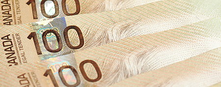 One Hundred Dollar Bills background / iStockphoto