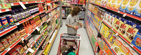 Woman shops at a dollar store (AP Photo/Tony Gutierrez)