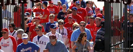 Fans enter Rangers Ballpark in Arlington. (Photo by Ronald Martinez/Getty Images)
