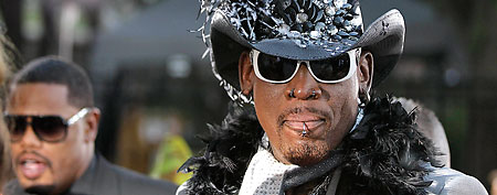 Former Chicago Bulls forward Dennis Rodman arrives at the Basketball Hall of Fame enshrinement ceremony in Springfield, Mass., on Friday night, Aug. 12, 2011. (AP Photo/Stephan Savoia)