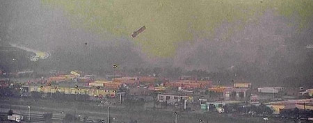 A trailer flies through the air as a tornado sweeps through the Dallas-Fort Worth area April 3, 2012 in this still image taken from video. (REUTERS/Reuters TV/NBC/Handout)