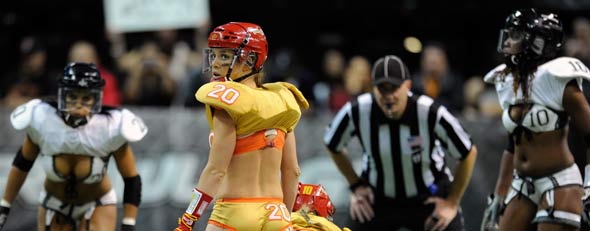 Quarterback Nikki Johnson #20 of the Las Vegas Sin checks the game clock during the team's Lingerie Football League game against the Los Angeles Temptation at the Orleans Arena November 11, 2011 in Las Vegas, Nevada. Las Vegas won 28-20. (Photo by Ethan Miller/Getty Images)