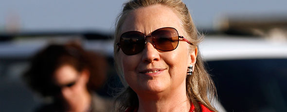 U.S. Secretary of State Hillary Rodham Clinton arrives at the airport to head to Brasilia, Brazil, from Cartagena, Colombia.   (AP/Jacquelyn Martin)