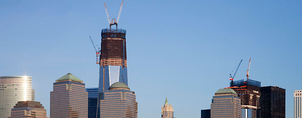 One World Trade Center, now up to 90 floors and heading to 104 floors, towers over the lower Manhattan skyline, Tuesday, Jan. 31, 2012 in New York. The agency building the new World Trade Center says a design flaw could add millions of dollars to the cost of the complex's signature tower. (AP Photo/Mark Lennihan)