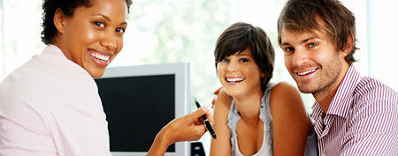 Couple with financial planner (Thinkstock)