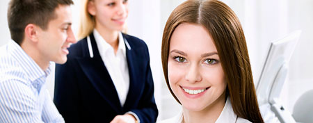 Woman at office with colleagues (Thinkstock)
