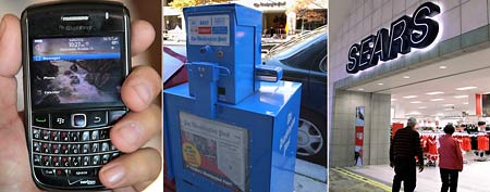(From left) A Research In Motion BlackBerry device, October 12, 2011 in Chicago, Illinois. (Photo Illustration by Scott Olson/Getty Images)/A Washington Post newspaper box in Washington, Friday, Nov. 3, 2006. (AP Photo/Dennis Cook)/In this Nov. 15, 2011 photo, customers enter a Sears store in Springfield, Ill. (AP Photo/Seth Perlman)