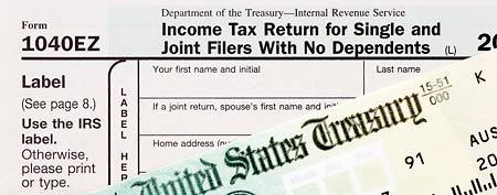 Tax form and check (Thinkstock)