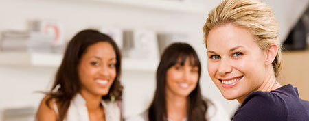 Businesswoman with coworkers (Thinkstock)