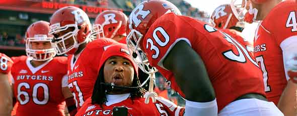 Eric LeGrand #52 of the Rutgers Scarlet Knights poses for a photo with teammates on Senior's Day (Photo by Patrick McDermott/Getty Images)