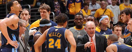 The Denver Nuggets huddle around head coach George Karl (Photo by Andrew D. Bernstein/NBAE via Getty Images)