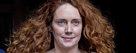 File: Rebekah Brooks, former chief executive of News International leaves the High Court in London after giving evidence to the Leveson Inquiry. She has been charged in connection with a phone hacking scandal. (AP Photo/Sang Tan)