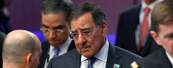 U.S. Secretary of Defense Leon Panetta mingles and talks with others attending the meeting on Afghanistan during the NATO Summit, Monday, May 21, 2012, in {city). (AP Photo/Carolyn kaster)
