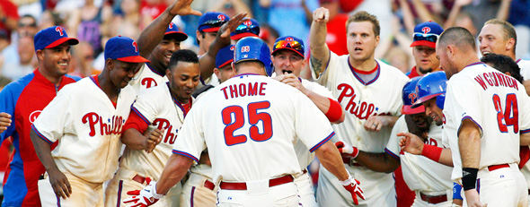The Phillies' Jim Thome celebrates with his teammates after he hit a solo home run against the Tampa Bay Rays in the ninth inning of an interleague baseball game Saturday, June 23, 2012, in Philadelphia.. (AP Photo/H. Rumph Jr)