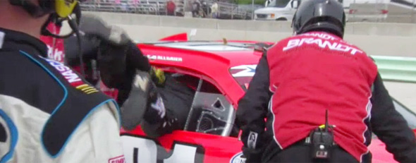 Justin Allgaier's crew works to remove an obstruction from his vehicle. (NASCAR.com)