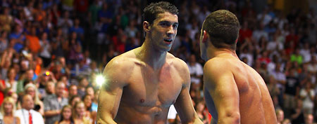 Gold-medalist Michael Phelps shakes hands with first-time Olympian Tyler Clary. (Getty Images)