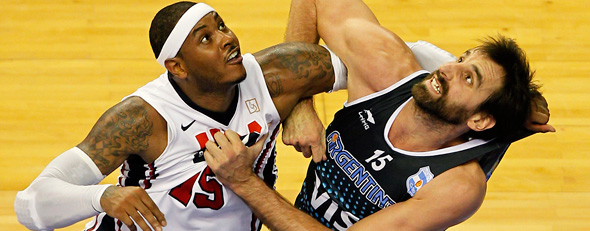 Carmelo Anthony of Team USA fights for a ball against Federico Kammerichs of Team Argentina during their men's exhibition basketball game Sunday (Albert Gea/Reuters).