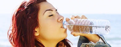 A woman drinks water. Photo: iStockphoto/Thinkstock