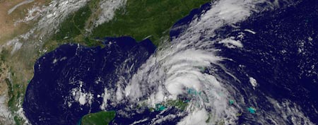 Tropical Storm Isaac is seen in this August 26, 2012 NASA handout satellite image as it approaches the Florida Keys. (Reuters)