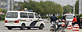 Police cars drive toward the entrance of a Foxconn Tech-Industry Park in Taiyuan, Shanxi province. (Reuters)