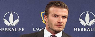 LOS ANGELES, CA - JANUARY 19: Midfielder David Beckham gets ready in his seat for the press conference announcing his new contract with the Los Angeles Galaxy at Staples Center on January 19, 2012 in Los Angeles, California. (Photo by Victor Decolongon/Getty Images)