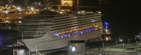 The Carnival cruise ship Triumph is pushed toward the terminal in Mobile, Ala. (Dave Martin/AP)