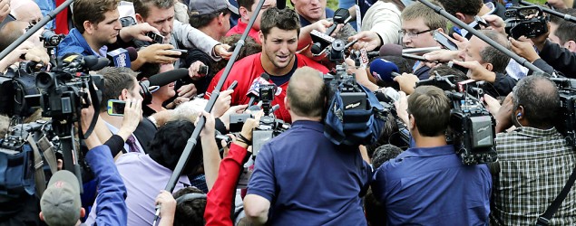 Patriots coach Bill Belichick deflates Tim Tebow buzz on first day of team's minicamp. (Charles Krupa/AP)