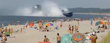 Bizarre landing on a crowded Russian beach (Y! Sports screenshot)