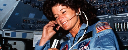 Johnson Space Center, Houston, Texas: On board Scene-Astronaut Sally K. Ride, STS-7 mission specialist, communicates with ground controllers from the flight deck of the Earth-orbiting Space Shuttle Challenger. Dr. Ride holds a tape recorder. The photograph was taken by one of her four fellow crewmembers with a 35mm camera. (Bettmann/CORBIS)