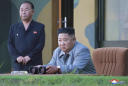NKorea fires 2 missiles into sea in likely protest of drills