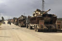 Syrian troops gain territory in push to control key highway