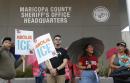 The Latest: 4 arrested as activists push sheriff to oust ICE