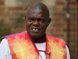 UK archbishop puts collar back on after Mugabe's fall