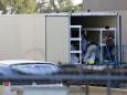 Photos show El Paso using refrigerated trucks in parking lots to store a backlog of bodies from a new COVID-19 surge