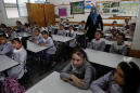 Gaza students back to school with few virus safety measures