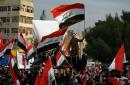 Iraqis protest to defy 'slaughter' in Baghdad as drone hits cleric's home