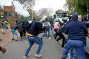 Protesters and S.African police clash at Zimbabwe embassy