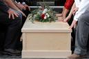 Slain in Mexico, 7-month-old twins buried in rain-swept funeral