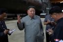 North Korea's Kim inspects new submarine, signals possible ballistic missile development