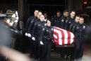 Slain police officer called 'American hero' at his funeral