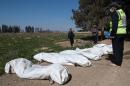 Severed heads found in mass grave near Syria IS pocket