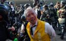 Hong Kong riot police pepper spray 'Airport Uncle' as election protests turn ugly