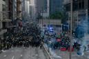 Hong Kong police fire tear gas as clashes return to city streets