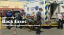 Kansas shooting suspect owes almost $400,000 in unpaid taxes
