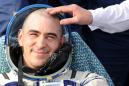 Russian cosmonaut votes on Putin's reforms from ISS