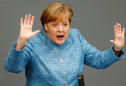 Merkel defends nuclear deal, Iran says won't 'surrender' to U.S.