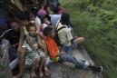 The Latest: Mexican townsfolk assist weary migrants
