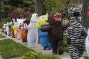 Detroit-area residents lift spirits with costumed parades